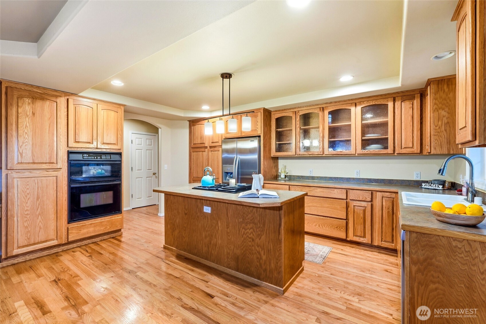 1026 McRae Road Northwest Arlington, WA 98223 - Photo 18 of 40 a kitchen with stainless steel appliances granite countertop a stove and a sink