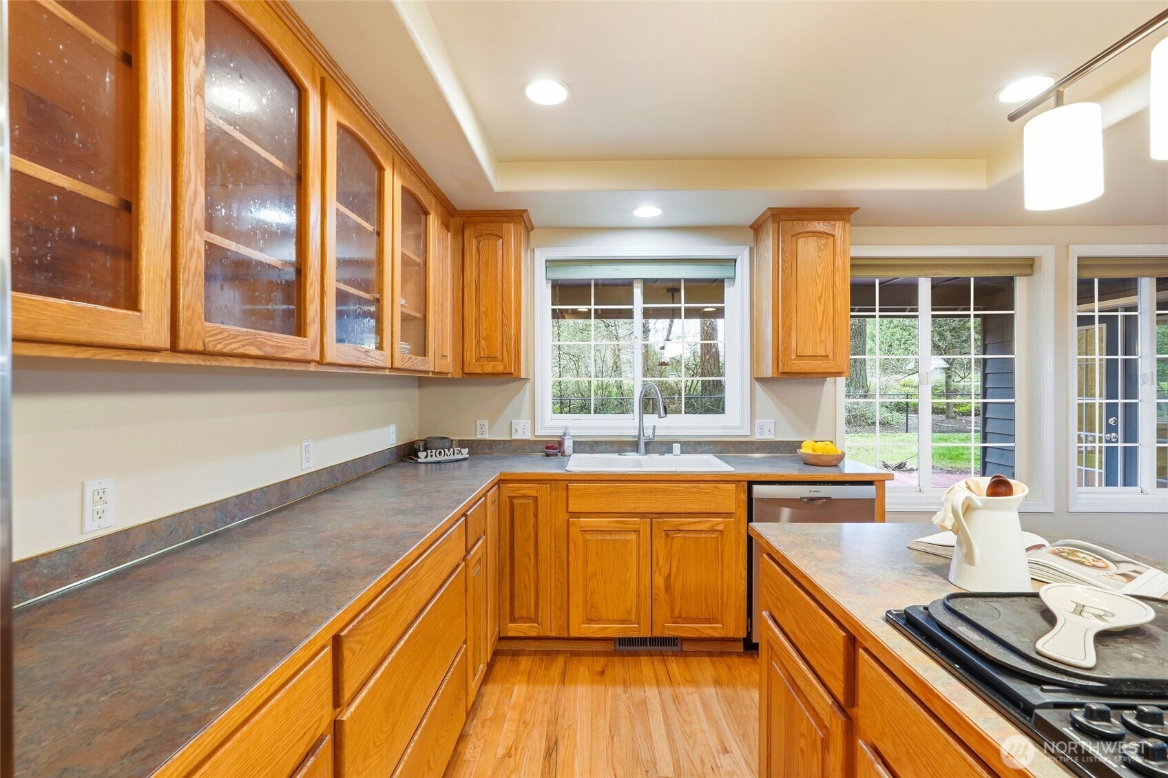 1026 McRae Road Northwest Arlington, WA 98223 - Photo 19 of 40 a kitchen that has a sink and a stove in it