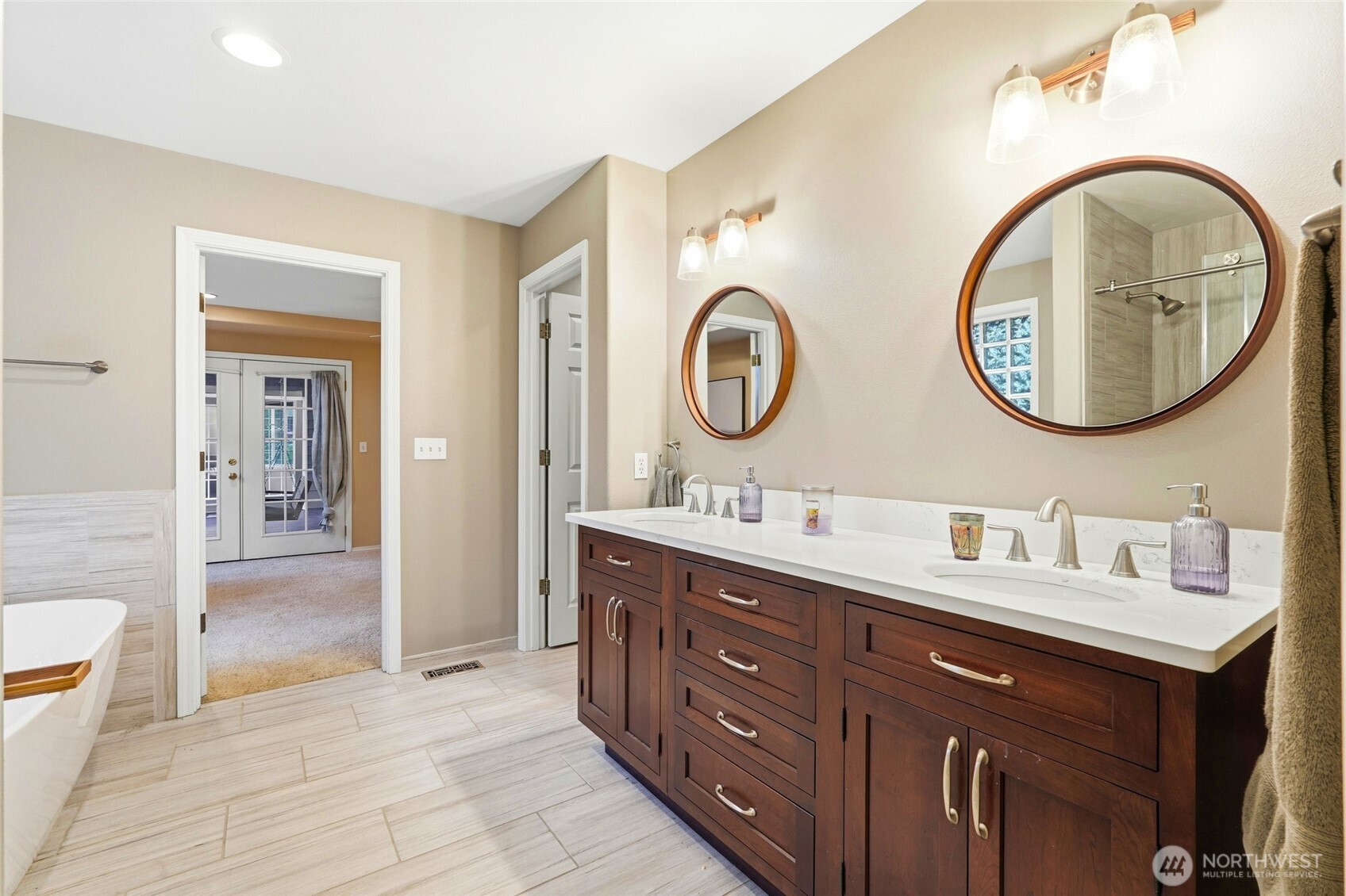 1026 McRae Road Northwest Arlington, WA 98223 - Photo 21 of 40 a bathroom with a double vanity sink and a mirror
