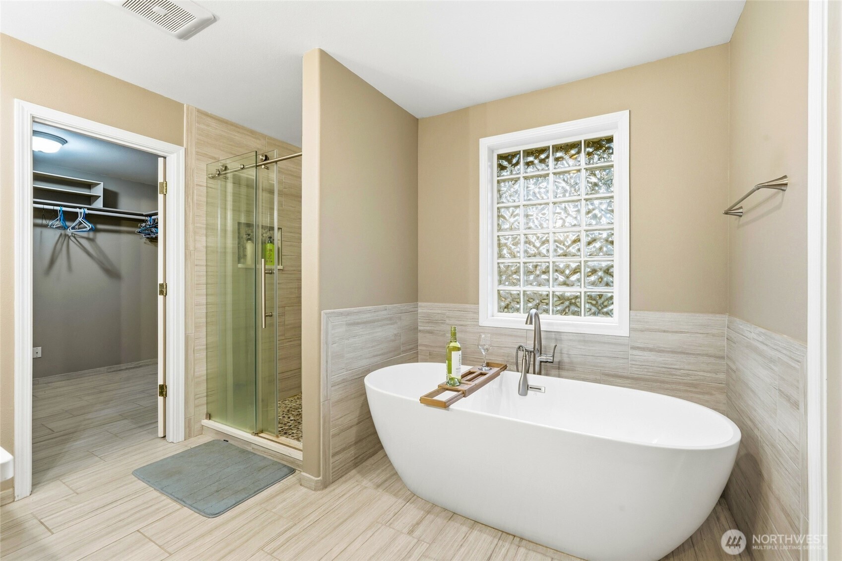 1026 McRae Road Northwest Arlington, WA 98223 - Photo 22 of 40 a white bath tub sitting in a bathroom next to a window