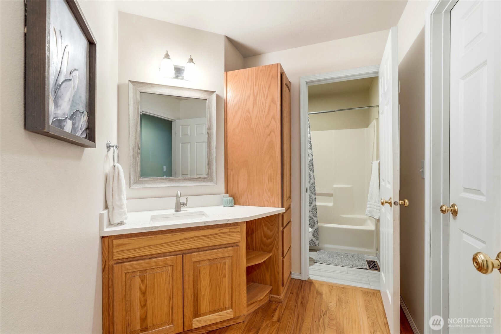 1026 McRae Road Northwest Arlington, WA 98223 - Photo 26 of 40 a bathroom with a sink a mirror and a shower