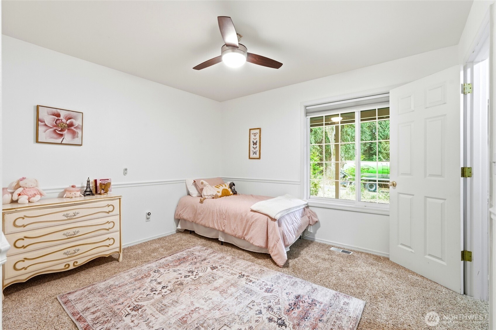 1026 McRae Road Northwest Arlington, WA 98223 - Photo 27 of 40 a bedroom with a bed and a window