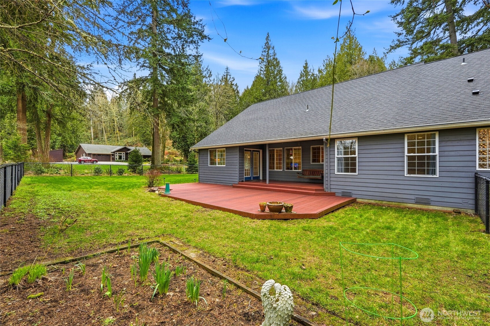 1026 McRae Road Northwest Arlington, WA 98223 - Photo 34 of 40 a aerial view of a house with swimming pool and garden
