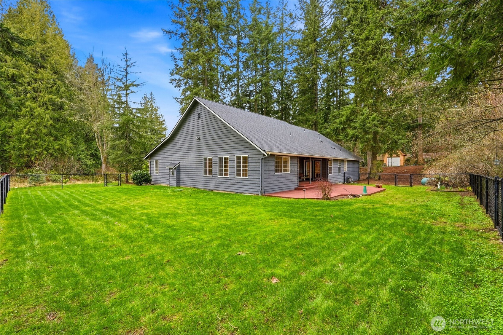 1026 McRae Road Northwest Arlington, WA 98223 - Photo 37 of 40 a view of a house with backyard and garden