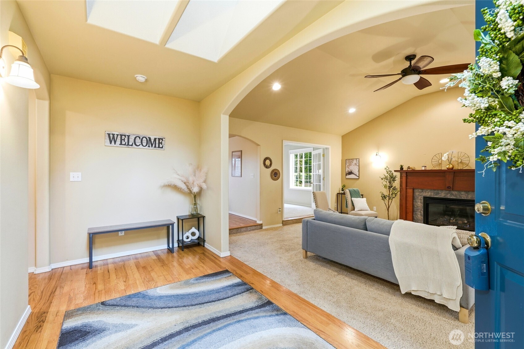 1026 McRae Road Northwest Arlington, WA 98223 - Photo 4 of 40 a living room with furniture and a fireplace