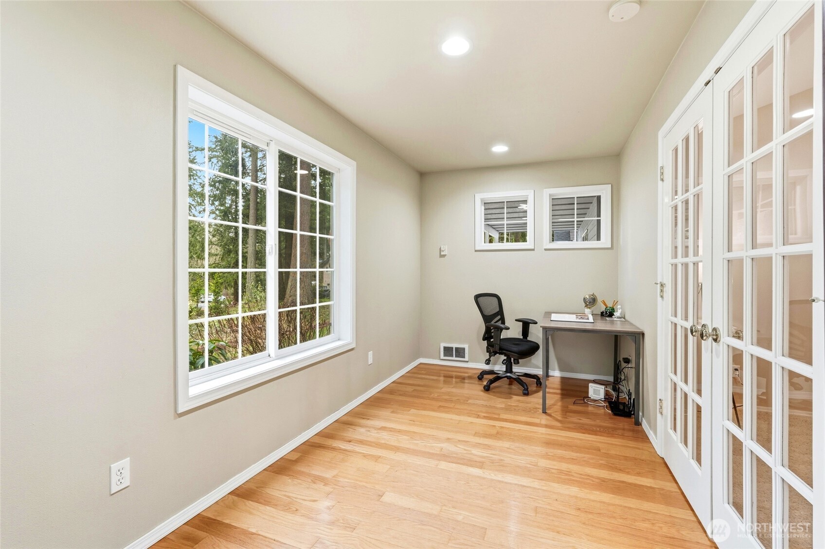 1026 McRae Road Northwest Arlington, WA 98223 - Photo 10 of 40 a view of a workspace with furniture and a window