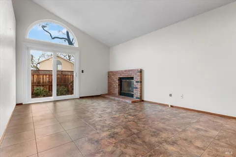 a view of a hallway with wooden walls