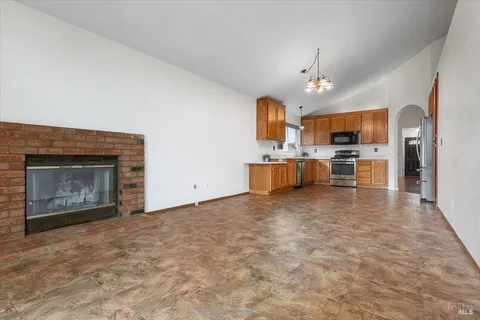 an empty room with a ceiling fan