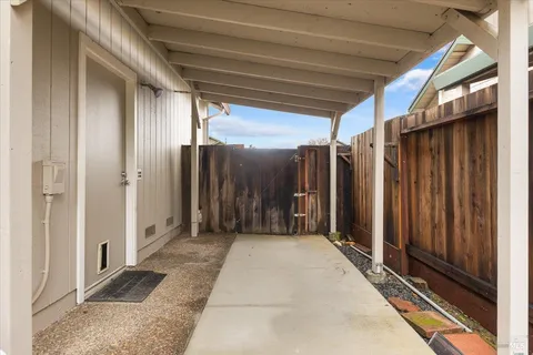 an empty room with a empty space and windows