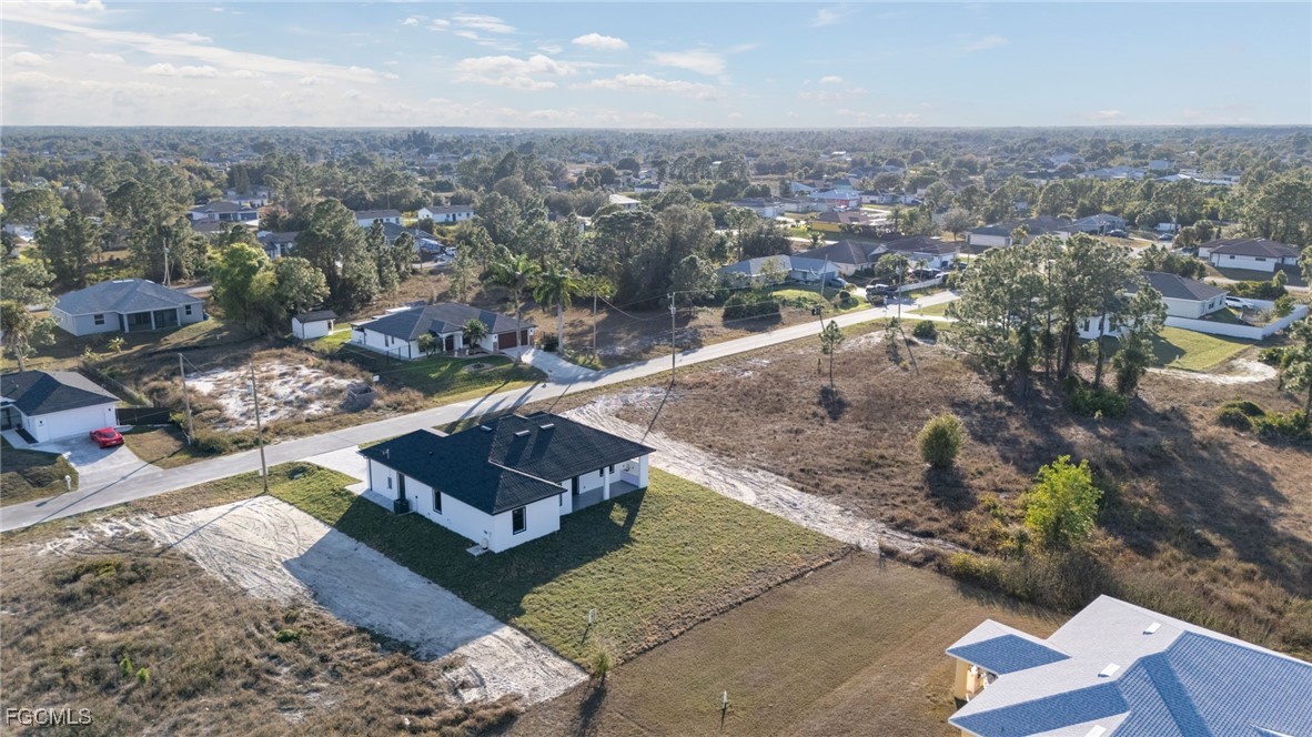 2506 36th Street Southwest Lehigh Acres, FL 33976 - Photo 23 of 25 an aerial view of a residential houses with outdoor space