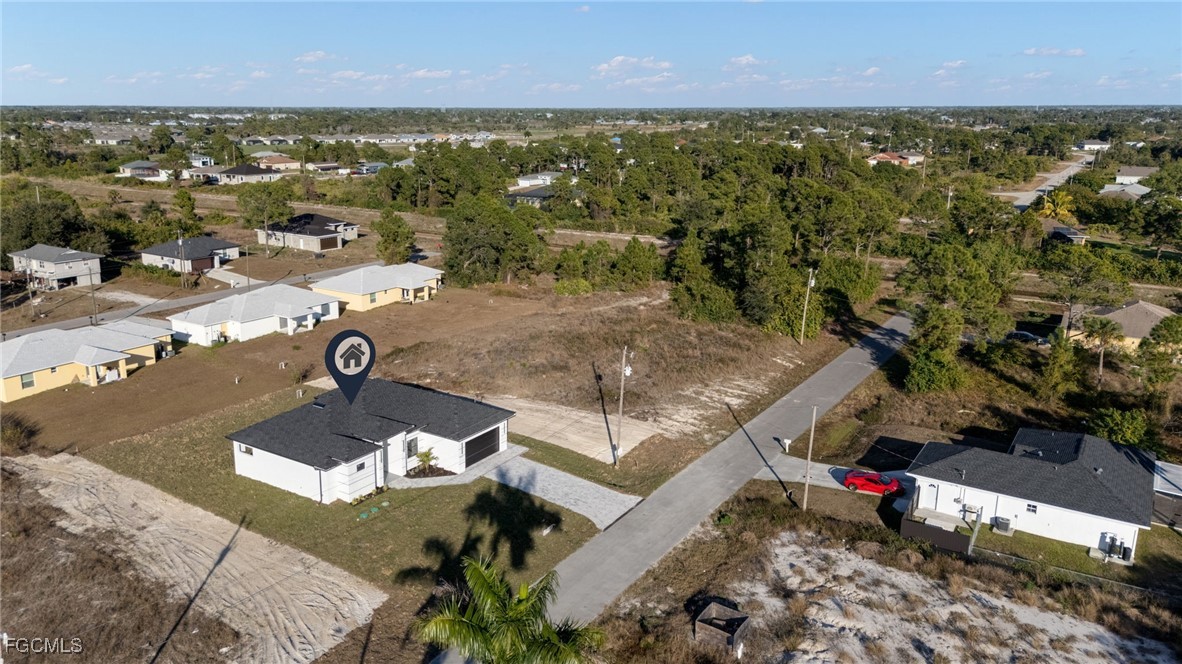 2506 36th Street Southwest Lehigh Acres, FL 33976 - Photo 25 of 25 an aerial view of residential houses with outdoor space