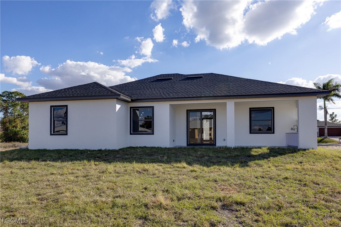 2506 36th Street Southwest Lehigh Acres, FL 33976 - Photo 3 of 25 a front view of house with yard