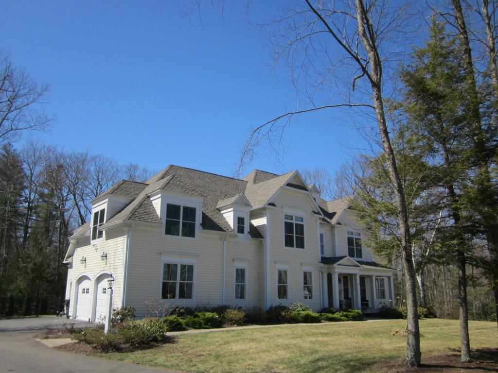 Exquisite colonial with charming covered porch.