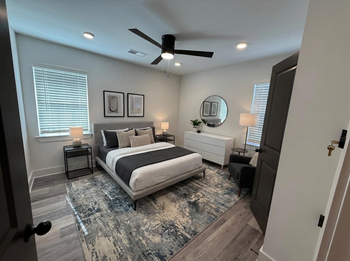963 Highway 54 Covington, TN 38019 - Photo 15 of 26 a bedroom with a large bed and a dresser