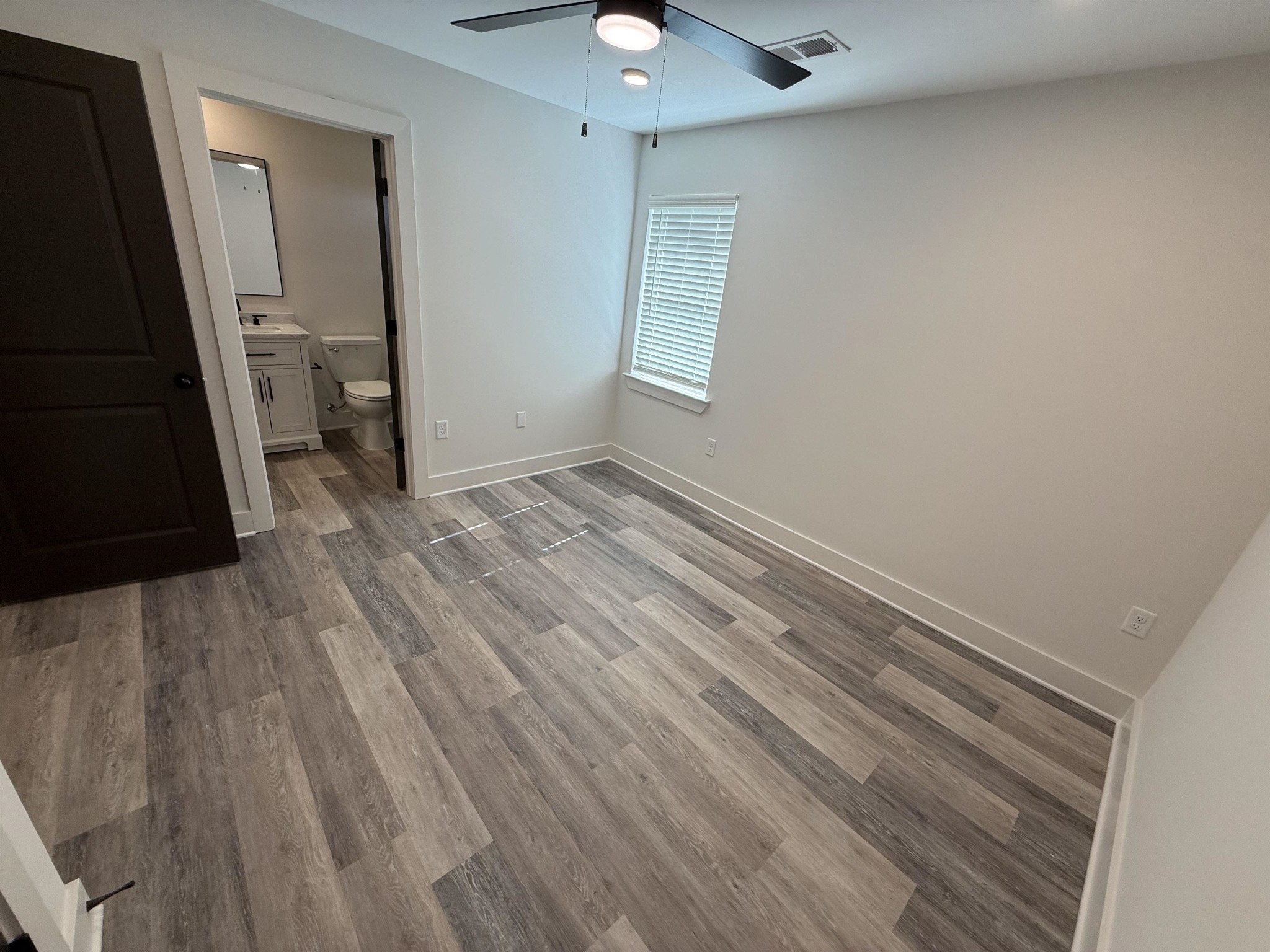 963 Highway 54 Covington, TN 38019 - Photo 17 of 26 a view of empty room with wooden floor