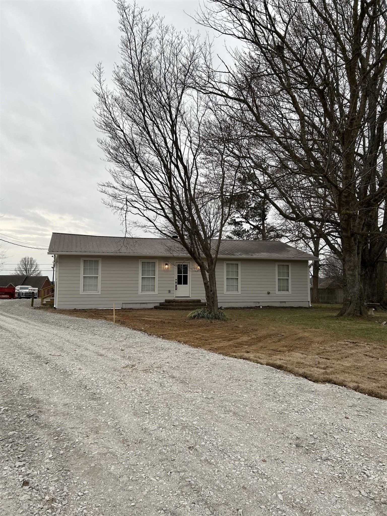 963 Highway 54 Covington, TN 38019 - Photo 2 of 26 front view of a house with a yard