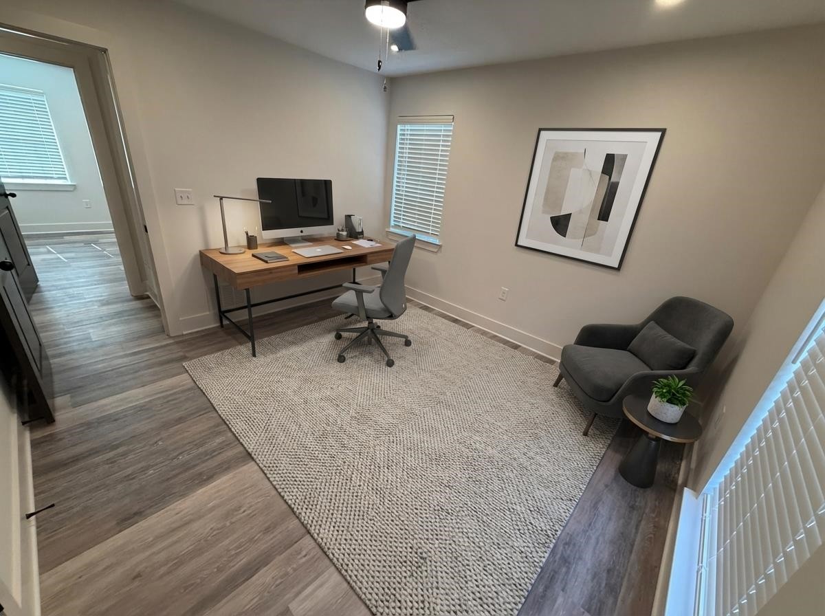 963 Highway 54 Covington, TN 38019 - Photo 23 of 26 a living room with furniture and a wooden floor