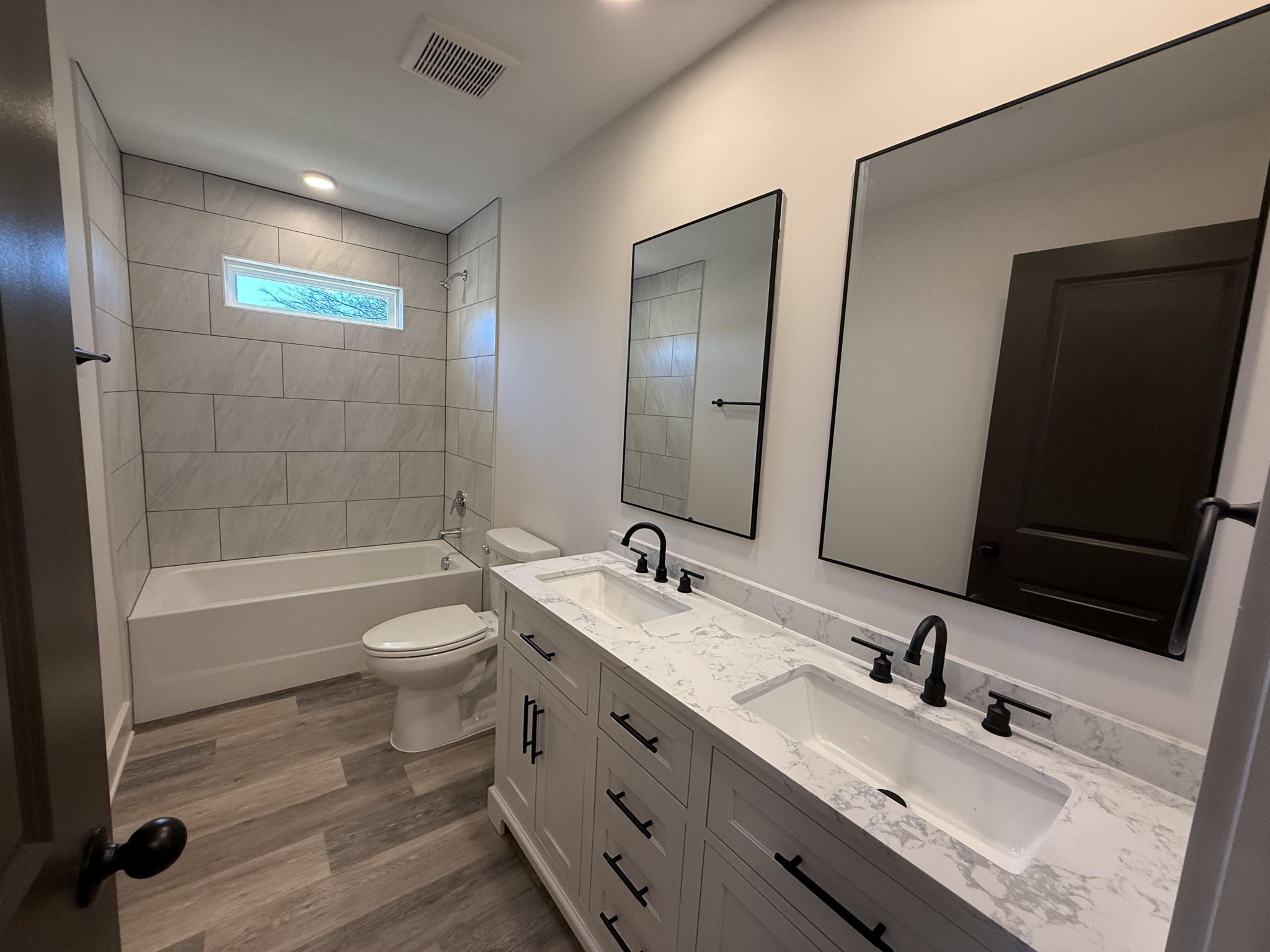 963 Highway 54 Covington, TN 38019 - Photo 26 of 26 a bathroom with a sink double vanity granite tub and a mirror