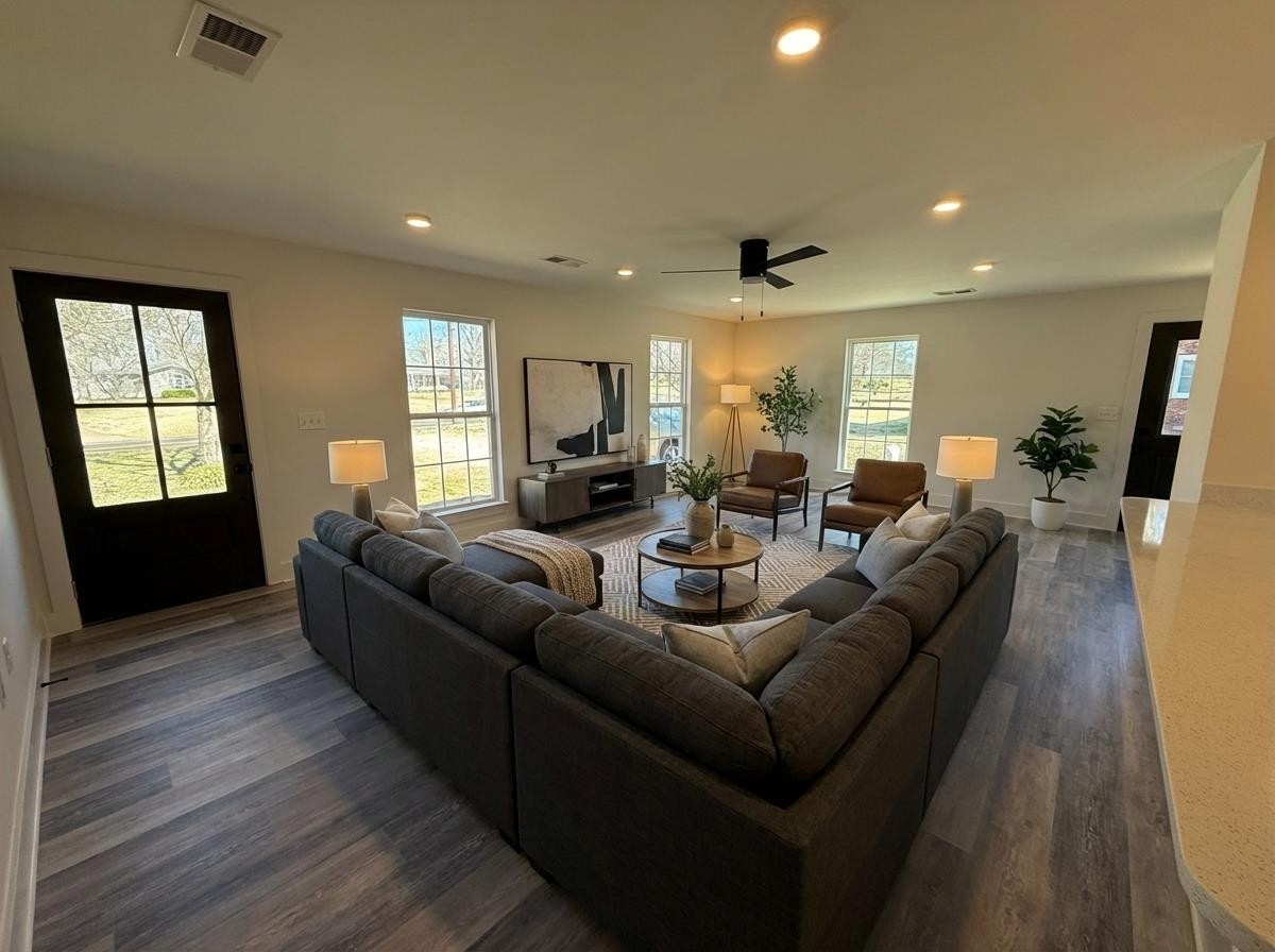 963 Highway 54 Covington, TN 38019 - Photo 6 of 26 a living room with furniture and a wooden floor