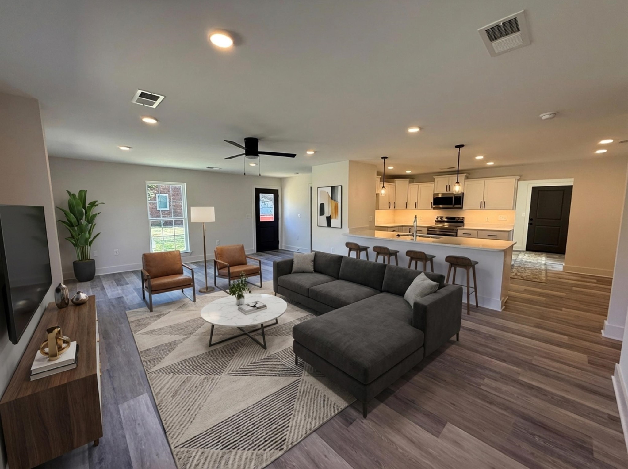 963 Highway 54 Covington, TN 38019 - Photo 8 of 26 a living room with furniture kitchen view and a wooden floor
