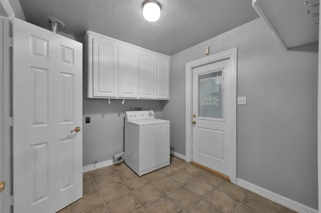 a view of a storage & utility room with closet