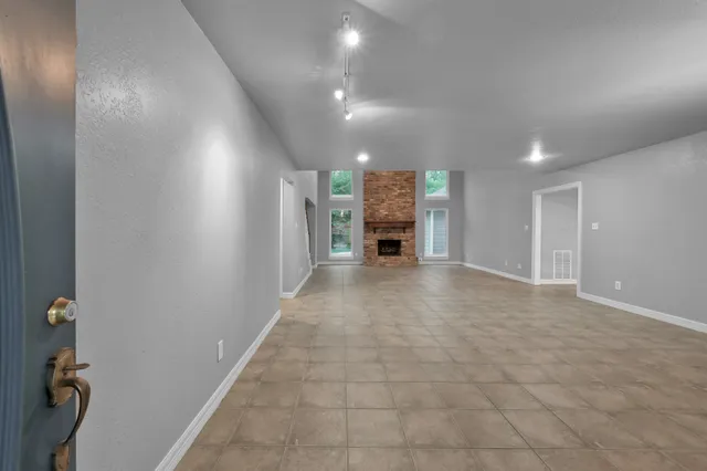 a view of livingroom with furniture and a stove