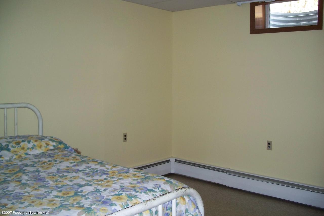 7432 Turnpike Road Montrose, PA 18801 - Photo 5 of 13 a bedroom with a bed