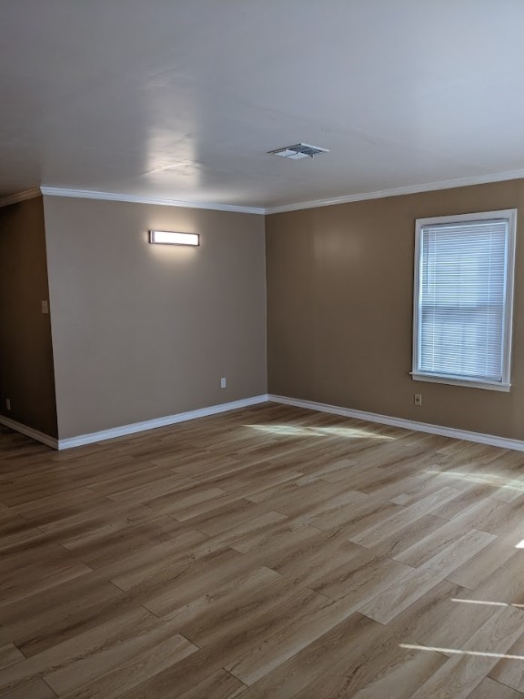 4217 Cambridge Drive Corpus Christi, TX 78415 - Photo 15 of 39 a view of an empty room with wooden floor and a window