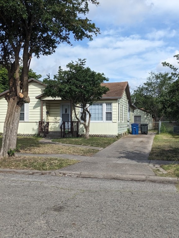 4217 Cambridge Drive Corpus Christi, TX 78415 - Photo 2 of 39 a front view of a house with a yard and garage