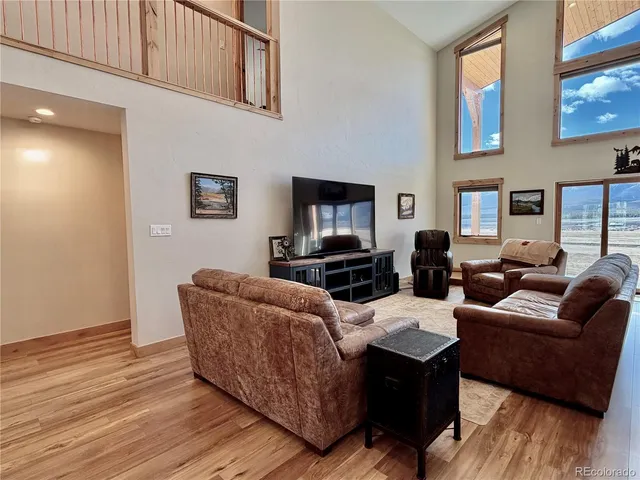 a kitchen with stainless steel appliances granite countertop a stove a refrigerator and a white cabinets