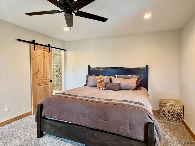 a spacious bathroom with a double vanity sink and a mirror