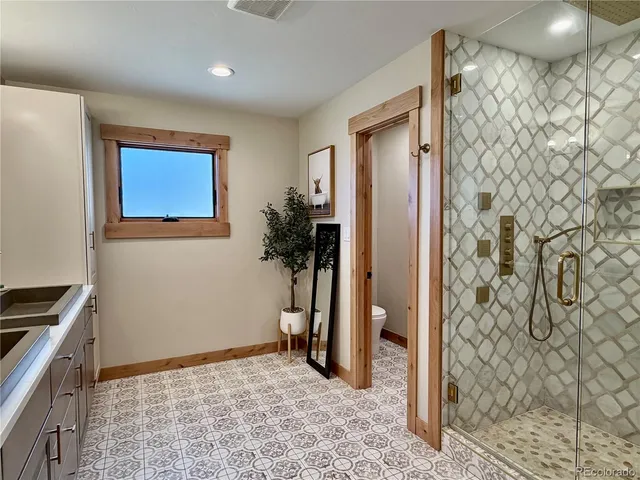 a view of a hallway with workspace and a mirror