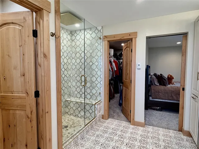 a bedroom with a bed and a walk in closet