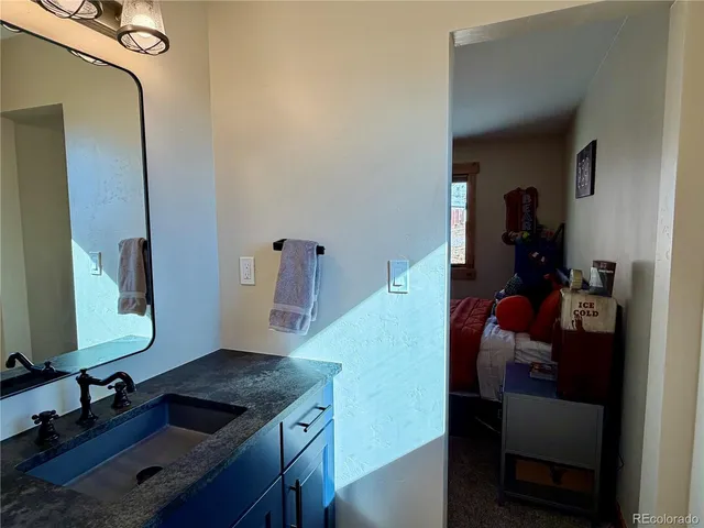 a view of a livingroom with furniture and a window