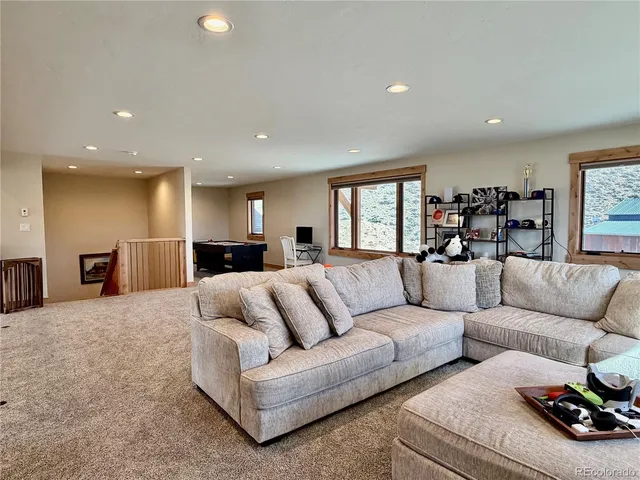 a bathroom with a granite countertop sink a mirror and shower