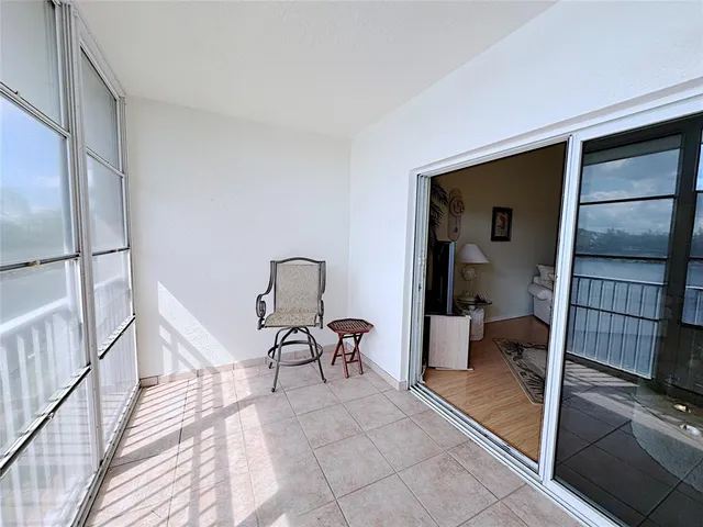 a view of a room with furniture and a rug