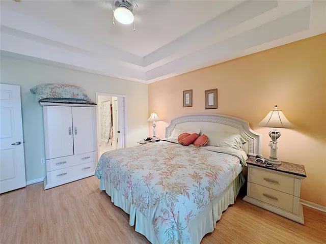 a bedroom with a bed and a lamp