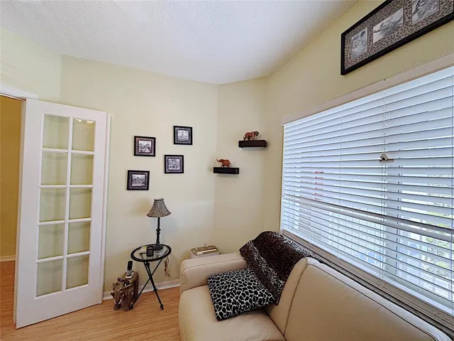 a living room with furniture and a window