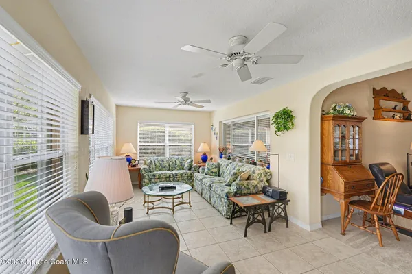 a living room with furniture and a window
