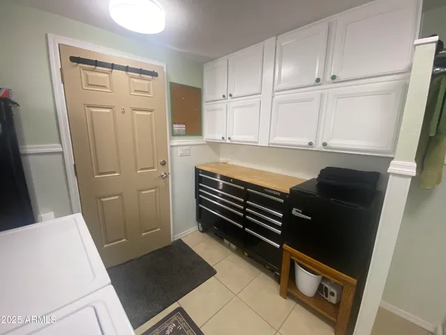 a bedroom with furniture and a window