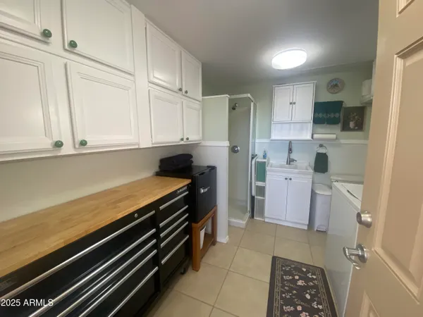 a kitchen with a sink and refrigerator