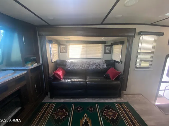 a bathroom with a granite countertop sink mirror vanity and toilet
