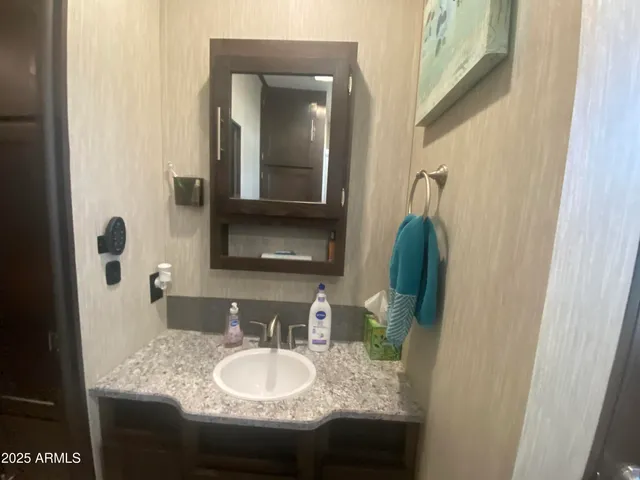 a view of a livingroom with workspace and a window