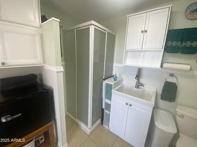a kitchen with stainless steel appliances a cabinets and a stove top oven