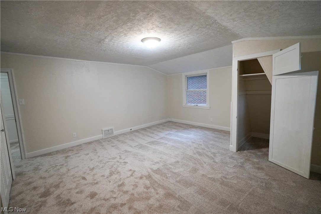 664 Ecton Road Akron, OH 44303 - Photo 20 of 35 Carpeted bedroom featuring a textured ceiling