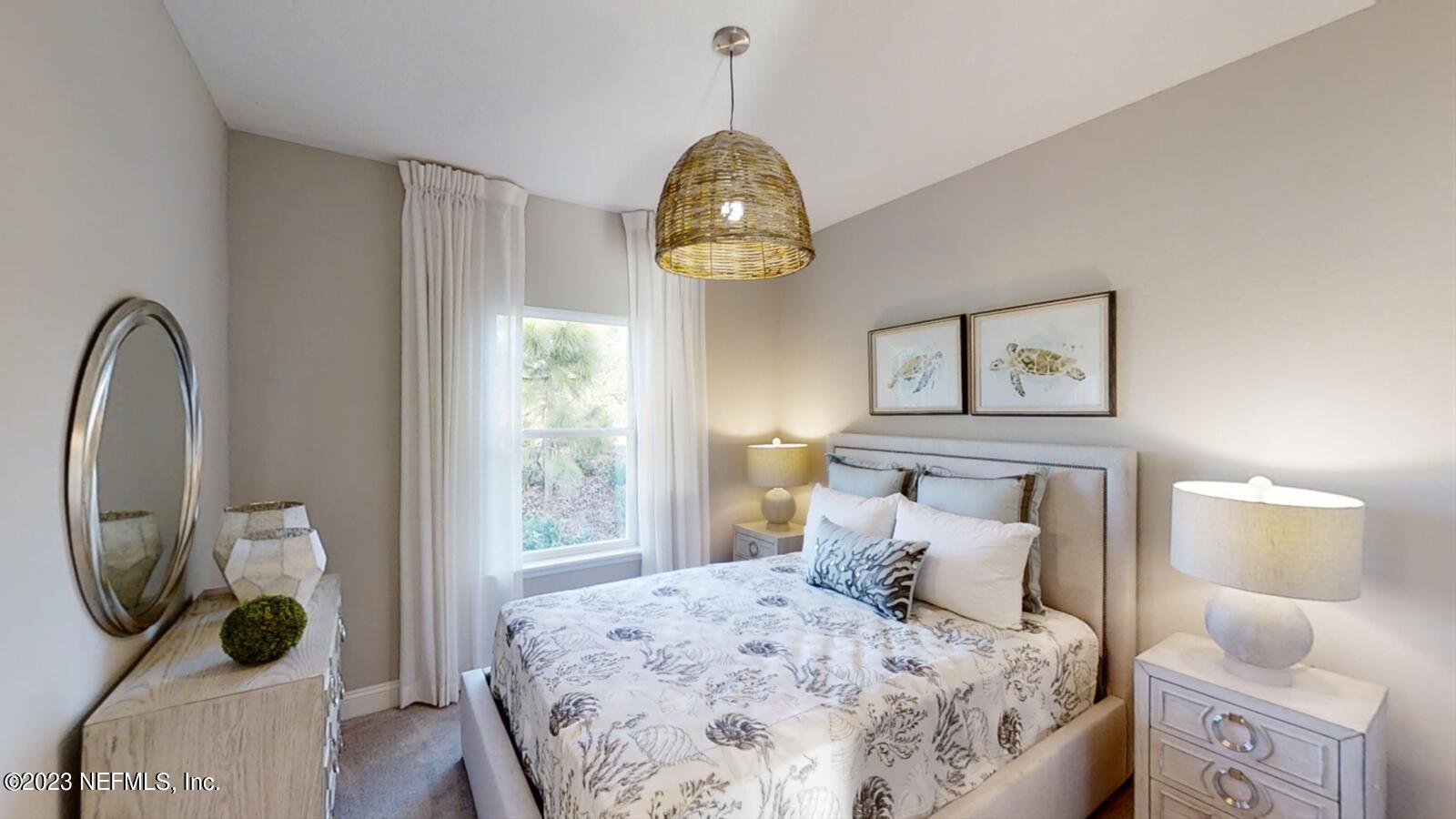 210 White Rabbit Run St. Augustine, FL 32092 - Photo 11 of 18 a bedroom with a bed a window and potted plant