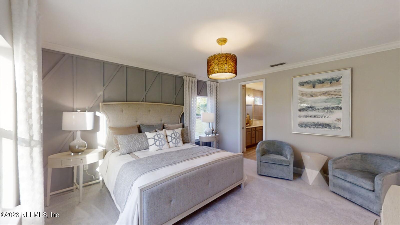 210 White Rabbit Run St. Augustine, FL 32092 - Photo 14 of 18 a bedroom with a bed and a couch