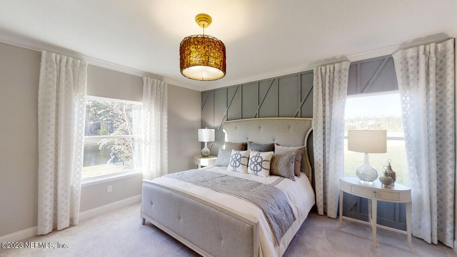 210 White Rabbit Run St. Augustine, FL 32092 - Photo 15 of 18 a bedroom with a bed and a window