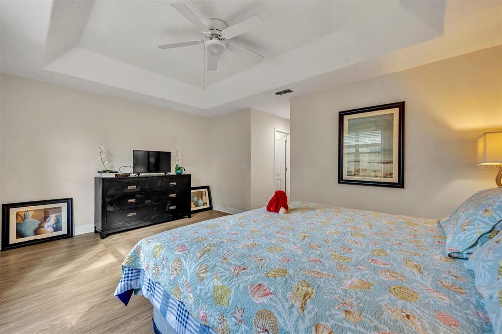 8177 Roseville Road Davenport, FL 33896 - Photo 17 of 39 a bed room with a bed and a television