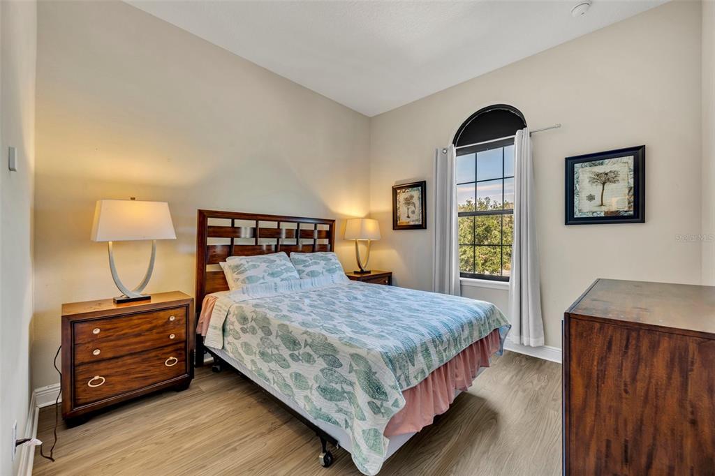 8177 Roseville Road Davenport, FL 33896 - Photo 20 of 39 a bedroom with a bed a mirror and a window